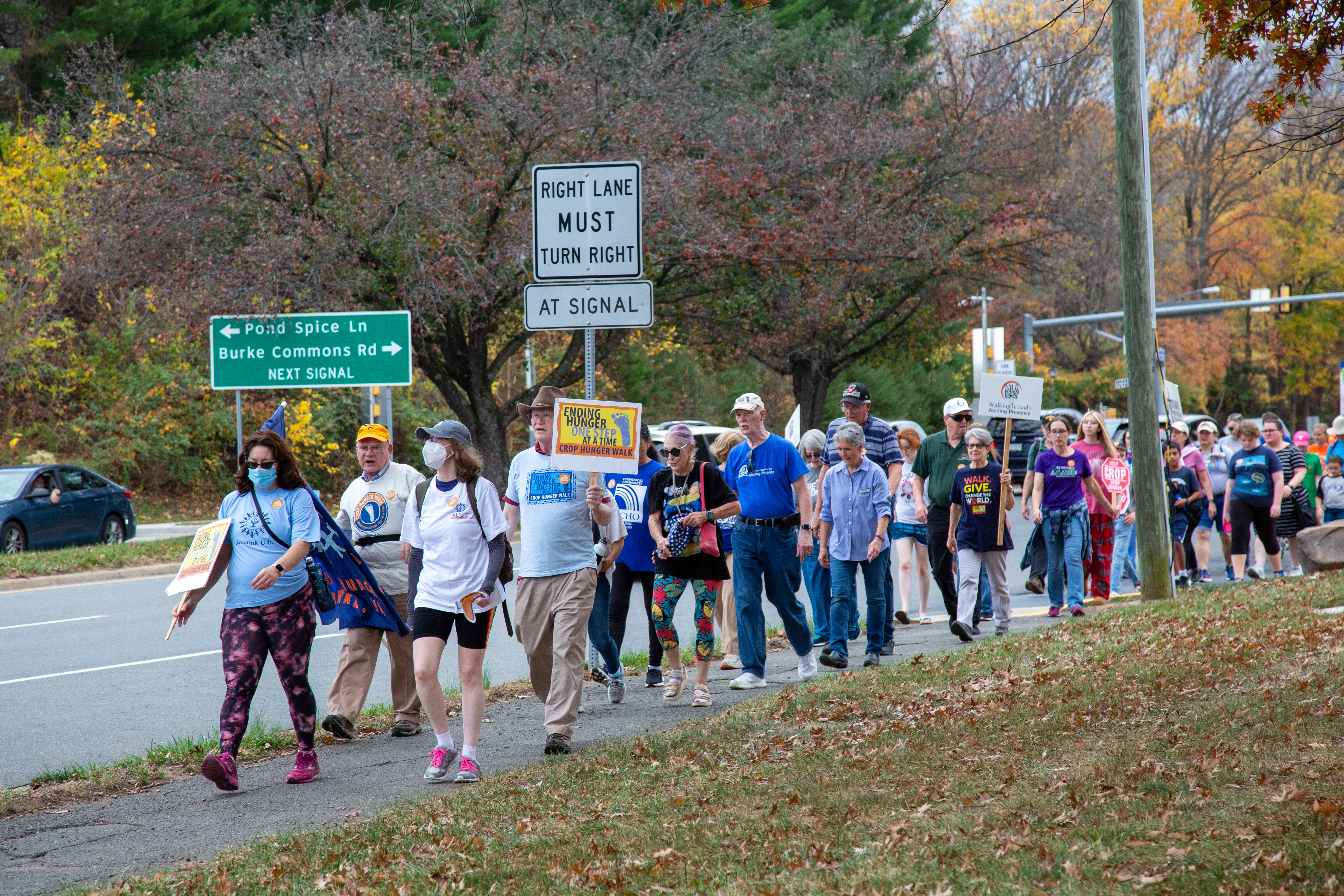 The walkers just crossed the Pond Spice Lane-Burke Commons Road crossroad.